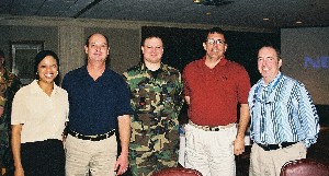 In March, chapter luncheon attendees gathering after the event included (l-r):  Josie Umoh; Bill Hinman; 1st. Lt. Clayton Baker, USAF, chapter secretary; Kevin Mayhew; and Mark Grant.